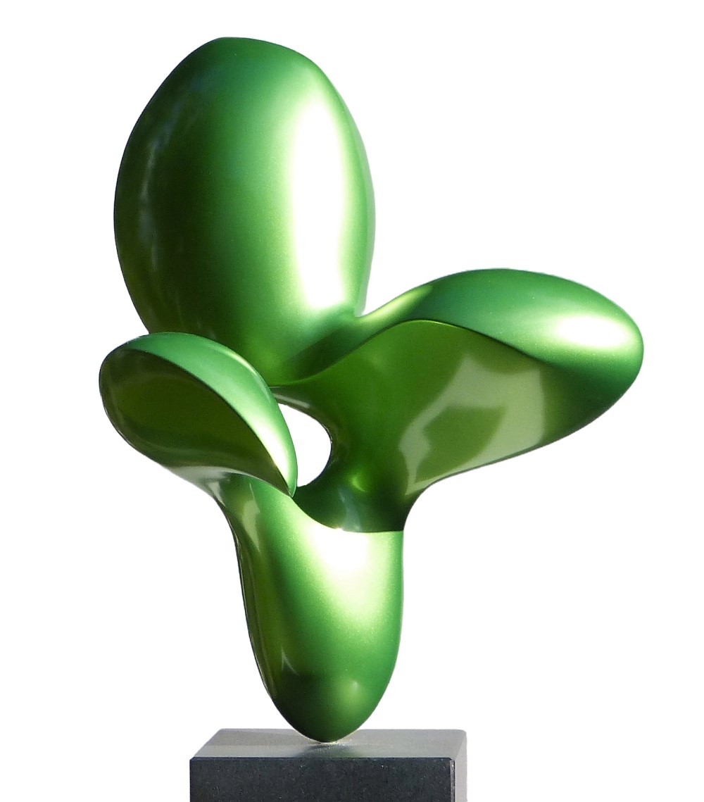 abstract organic sculpture with a shiny green surface.