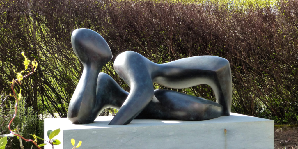 Bronze sculpture of a lying man