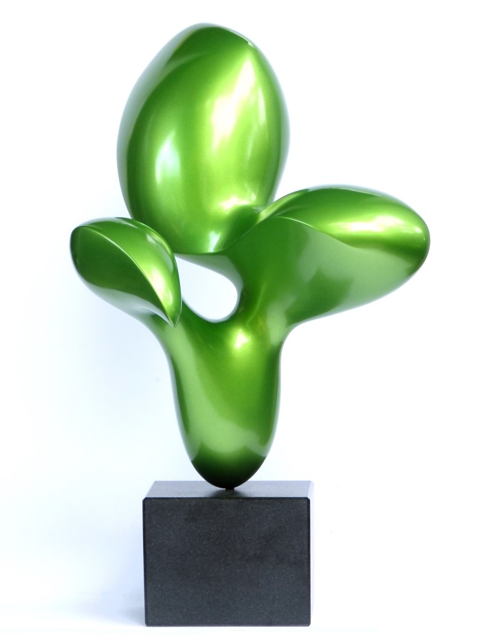 abstract organic sculpture with a shiny green surfaceon a black granite base