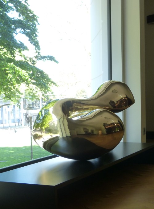 High polished abstract brass sculpture with smooth organic forms