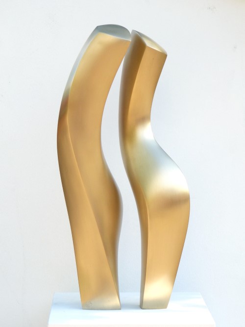 Two corresponding bronze figures, matt gold patinated with smooth surfaces and soft edges.